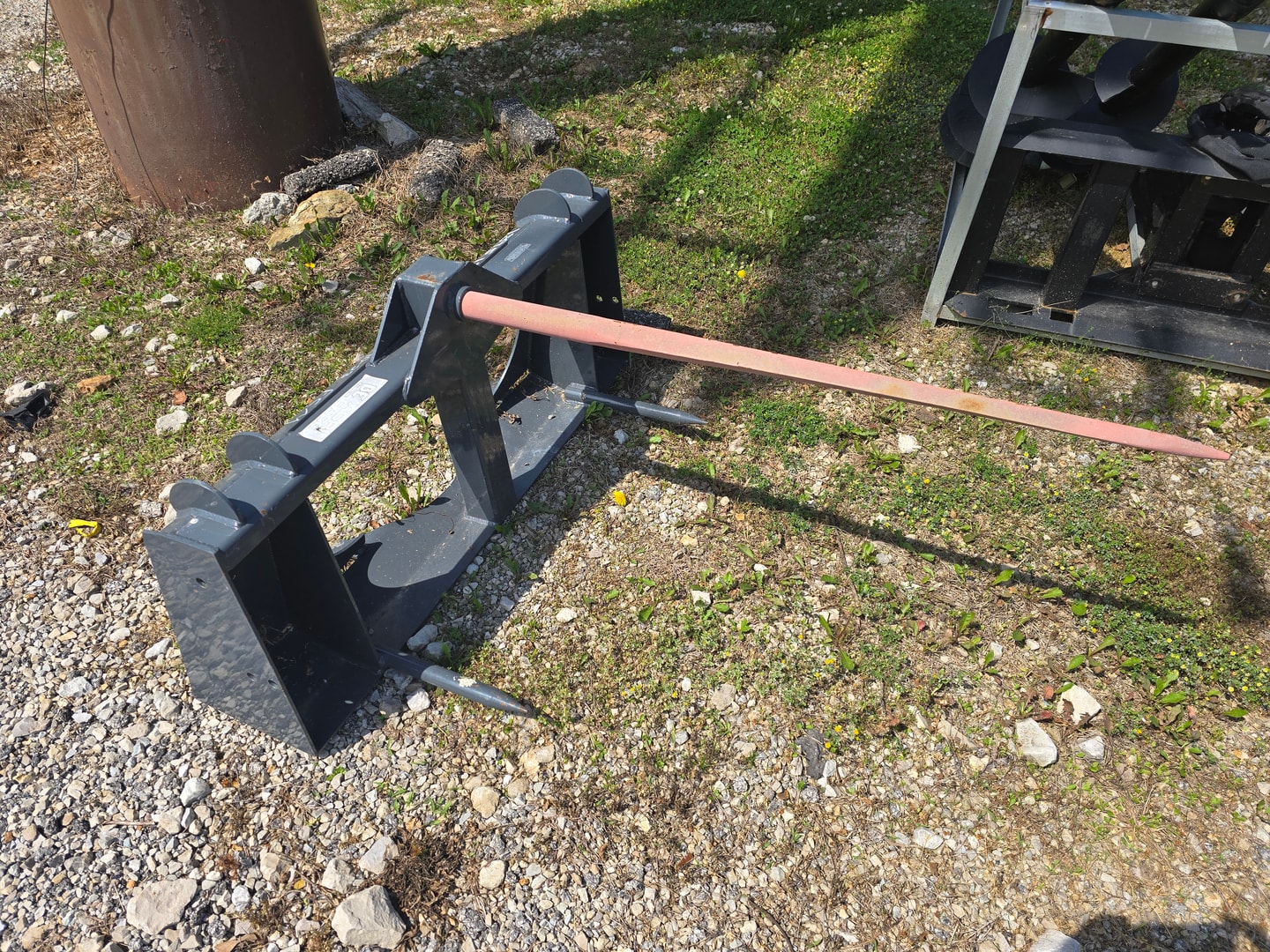 Skid steer with rock grapple rake