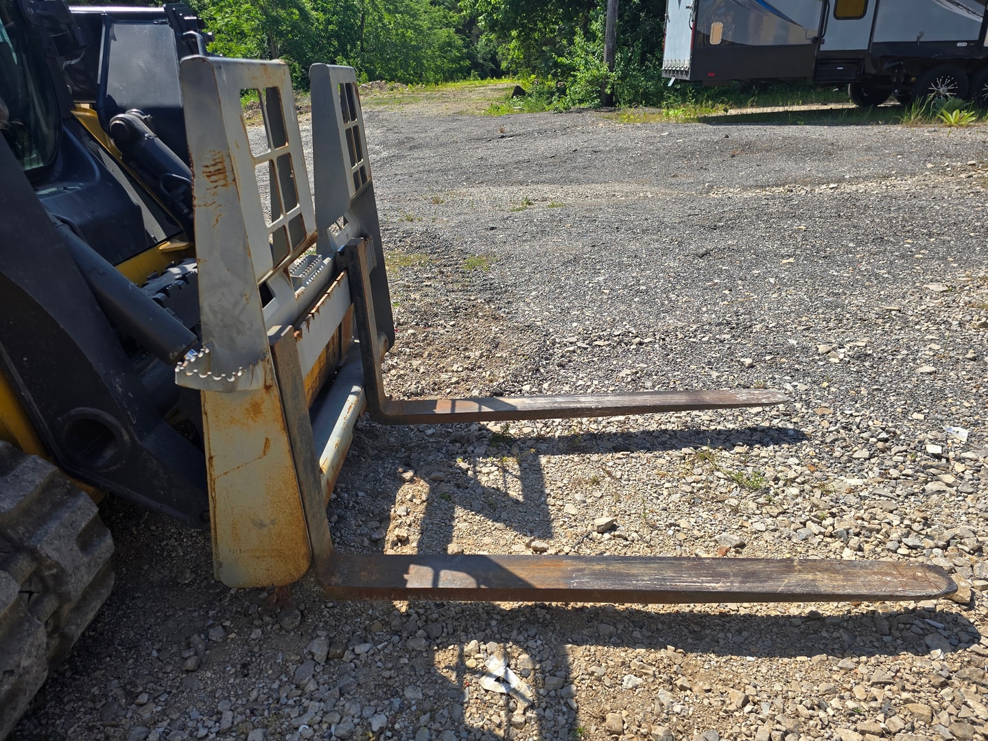 Heavy duty pallet forks on skid steer